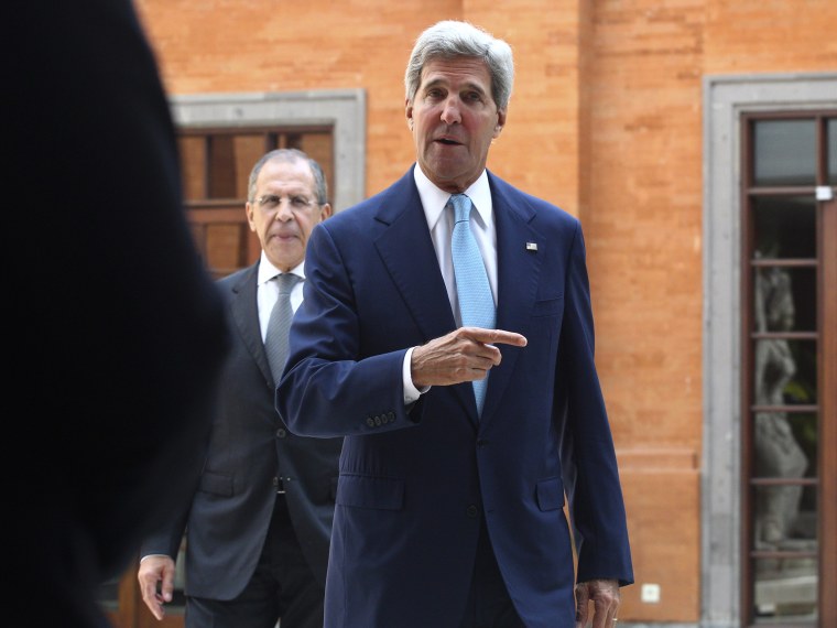 U.S. Secretary of State John Kerry gestures as he walks followed by Russian Foreign Minister Sergey Lavrov for a bilateral meeting on the sidelines of the Asia-Pacific Economic Cooperation (APEC) summit in Bali, Indonesia, Monday, Oct. 7, 2013.
