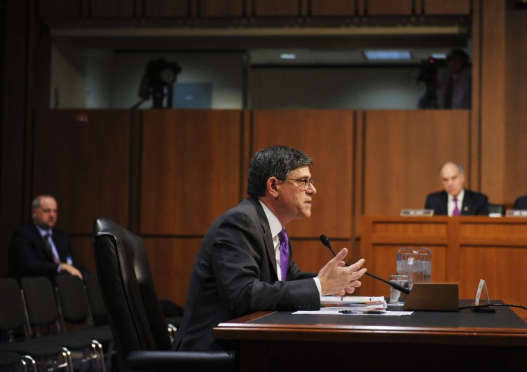 US Treasury Secretary Jack Lew (R) testifies before the US Senate Finance Committee about the debt limit on Oct. 10, 2013