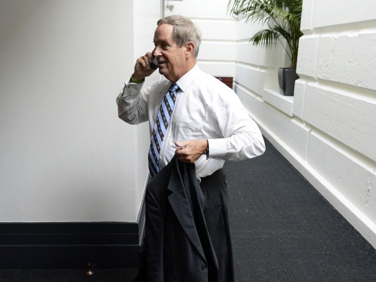 Republican Representative from South Carolina, Joe Wilson speaks on a cell phone while walking to a meeting of House Republicans on the fourth day of a partial federal government shutdown, on Capitol Hill in Washington DC, USA, 04 October 2013.