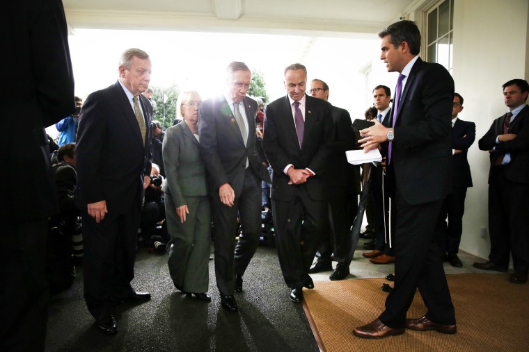 U.S. Senate Democrats leave after a meeting between President Barack Obama at the White House October 10, 2013.