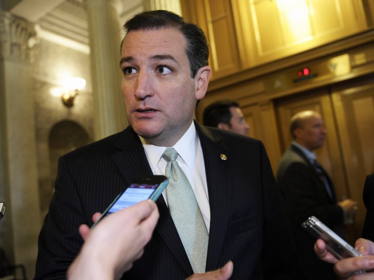 Sen. Ted Cruz talks with reporters following a vote on Capitol Hill in Washington, Wednesday, Oct. 9, 2013.