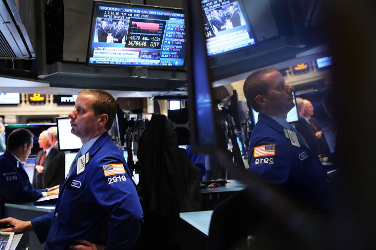 Traders work on the floor of the New York Stock Exchange minutes before the closing bell on Oct. 8, 2013 in New York City.