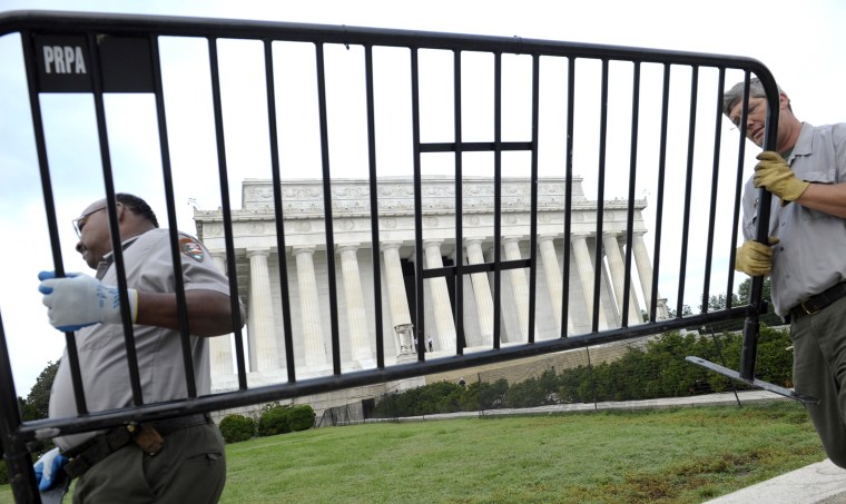 National Park Service employees remove barricades from the grounds of the Lincoln Memorial
