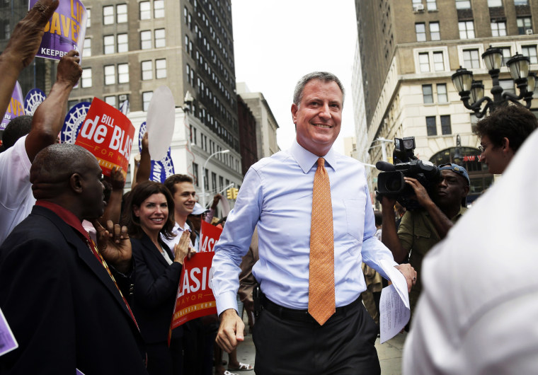 Democratic mayoral candidate Bill de Blasio, center, arrives at a rally in the Brooklyn borough of New York, Thursday, Sept. 12, 2013.