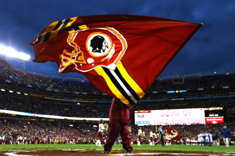 A Washington Redskins flag is waved prior to the NFC Wild Card Playoff Game