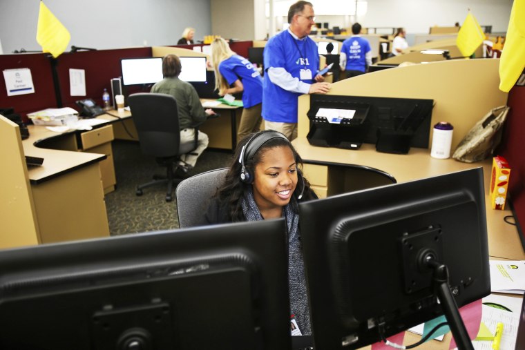 Shaldonia Barney, a service agent at Covered California's Concord call center, takes a call during the opening day of enrollment of the Patient Protection and Affordable Care Act in Concord, California October 1, 2013.