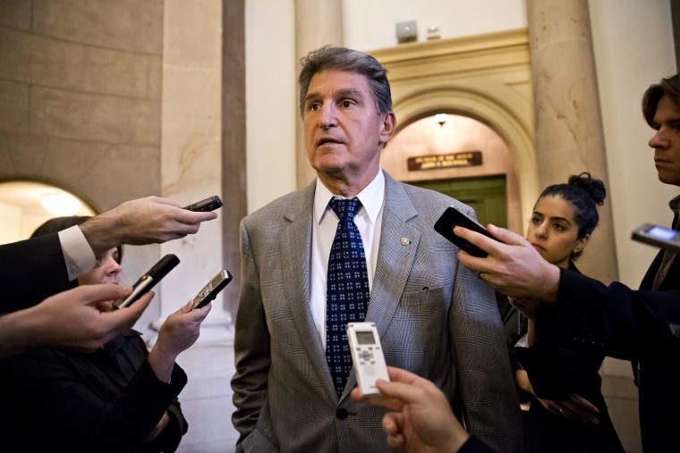 Sen. Joe Manchin, D-W.Va., is questioned for updates by reporters at the Capitol in Washington, Monday, Oct. 14, 2013, as a partial government shutdown enters its third week.