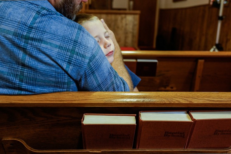 A young member of the Friendship Baptist Church congregation at Sunday services in Cawood, KY.