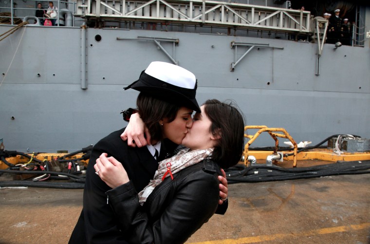 Petty Officer 2nd Class Marissa Gaeta, left, kisses her girlfriend of two years, Petty Officer 3rd Class Citlalic Snell at Joint Expeditionary Base Little Creek in Virginia Beach, Va., Wednesday, Dec. 22, 2011.