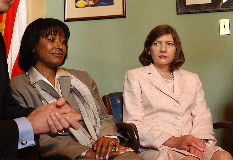 Judicial nominees Janice Rogers Brown, center, and Priscilla Owen pose for pictures on Capitol Hill Tuesday, May 17, 2005.