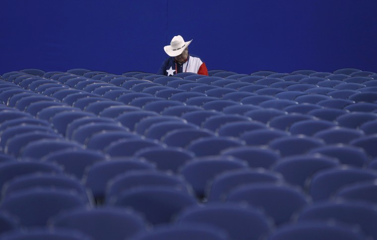 A delegate from Texas waits for the start of the session during the second day of the Republican National Convention in Tampa, Florida August 28, 2012.