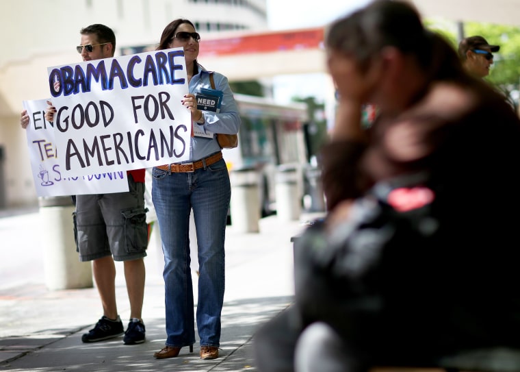 Haydee Perkal shows her support for the Affordable Care Act during a rally, October 10, 2013 in Miami, Florida.