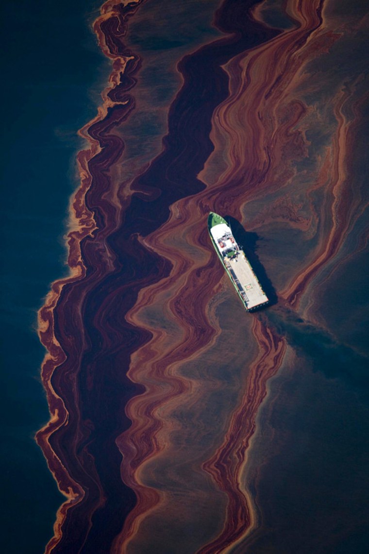 An aerial view of the oil leaked from the Deepwater Horizon wellhead, May 6, 2010, 17 days after the explosion that killed 11 workers. Oil from a massive spill in the Gulf of Mexico sloshed ashore on a chain of islands off the Louisiana coast.