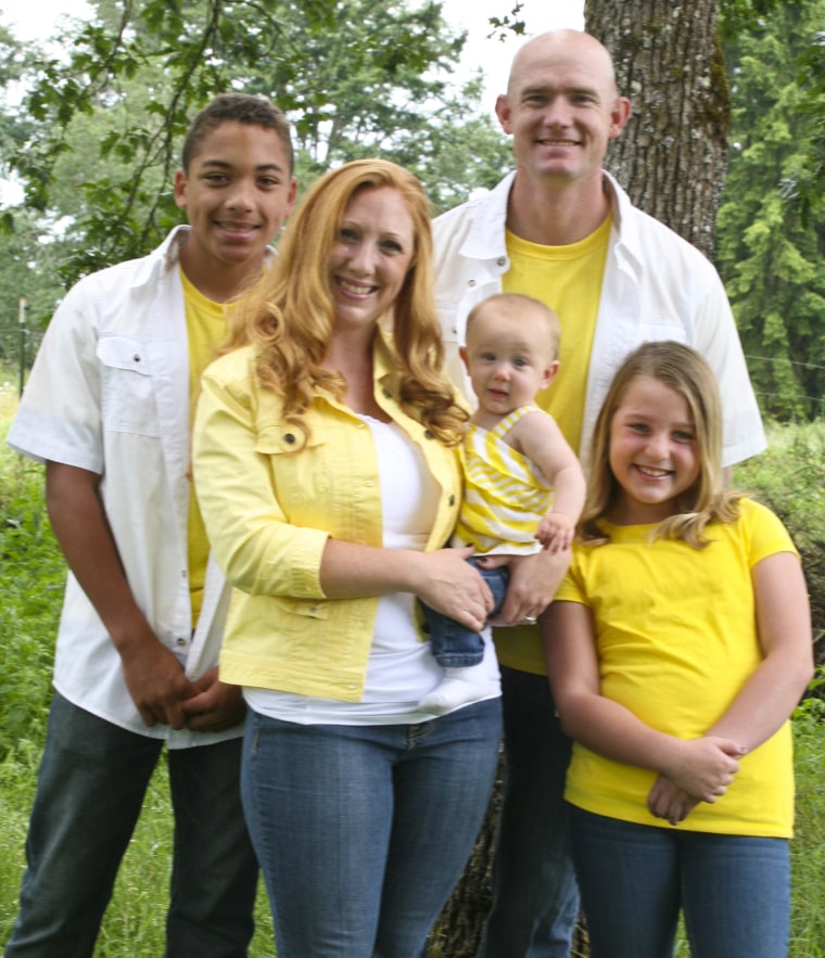 Staff Sgt. Ty Carter and his family, son Jayden, wife Shannon, daughter Sehara, and daughter Madison in a family photo taken on their farm in Yelm, Wash., July, 2013.
