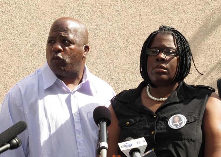Kenneth and Jacquelyn Johnson, whose son Kendrick was found dead in a wrestling mat, appear at a press conference on Thursday, Oct. 31 2013 in Tallahassee, Fla.