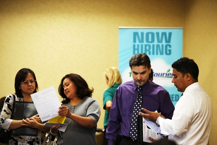 A job seeker meets with a recruiter during the East Bay's HIREvent on October 8, 2013 in Emeryville, California.
