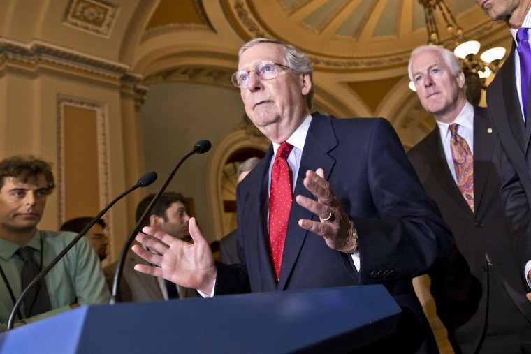 Senate Minority Leader Mitch McConnell of Ky., left, accompanied by Senate Minority Whip John Cornyn of Texas, center, and Sen. John Thune, R-S.D., Senate Republican Conference chairman, talks about the startup problems of the Affordable Care Act as they