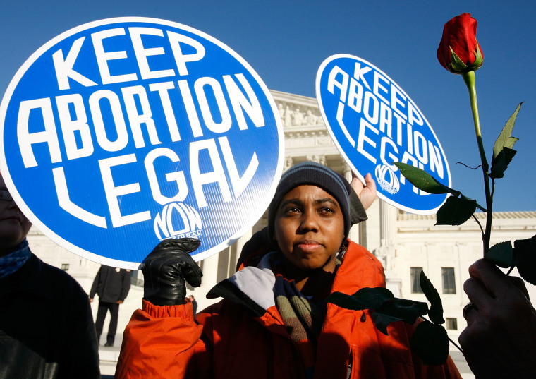 Image: A local pro-choice activist in front of the U.S. Supreme Court in Washington, D.C. January 22, 2009.