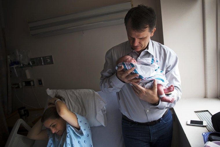 Dale Smith holds his newborn baby at the New York Downtown Hospital, Dec.12, 2012.