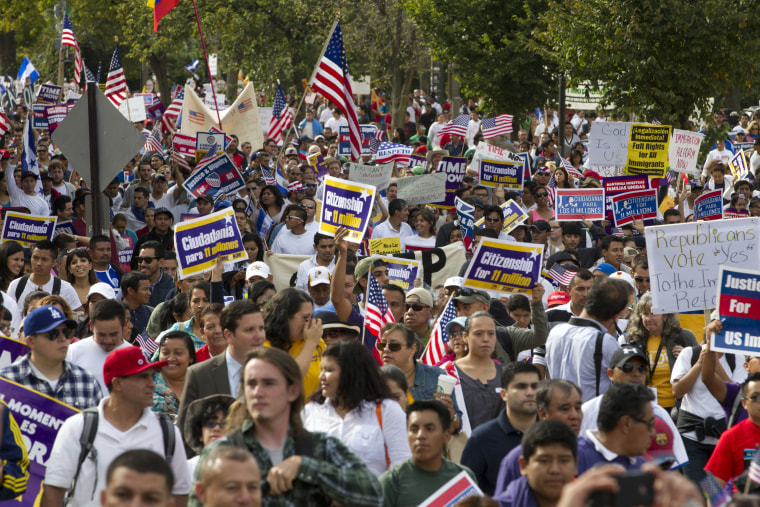 Demonstrators march towards Capitol Hill during a immigration rally and march in Washington, D.C., Tuesday, Oct. 8, 2013.