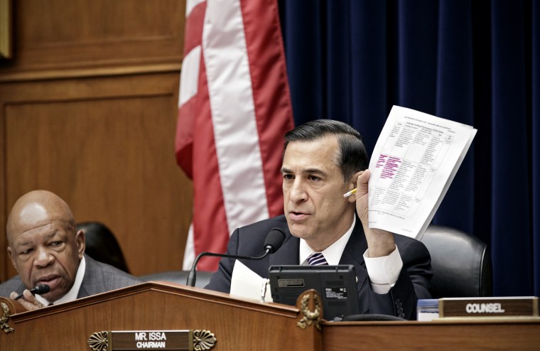 Darrell Issa, R-Calif., holds up a document during a hearing on the problems with implementation of the Obamacare healthcare program on Capitol Hill in Washington, on Nov. 13, 2013.