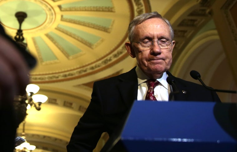 Senate Majority Leader Senator Harry Reid (D-NV) speaks to members of the media after the Senate Democratic weekly policy luncheon on Nov. 19, 2013 on Capitol Hill in Washington, DC.