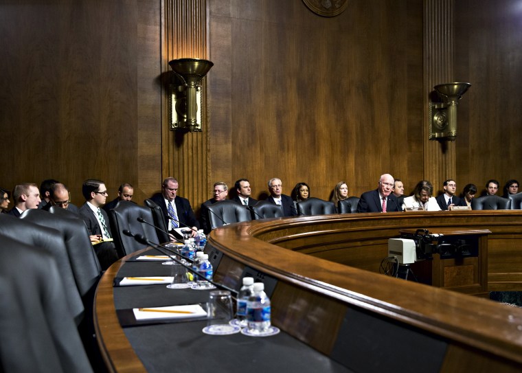 Sen. Patrick Leahy  expresses frustration as the seats on the Republican side of the Senate panel remain empty, causing the cancellation of a meeting to consider President Barack Obama's judicial nominations, Nov. 21, 2013.