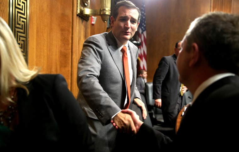 Senate Judiciary Committee member Sen. Ted Cruz (R-TX) (C) shakes hands with David Barron after his nomination hearing in the Dirksen Senate Office Building on Nov. 20, 2013 in Washington, DC.
