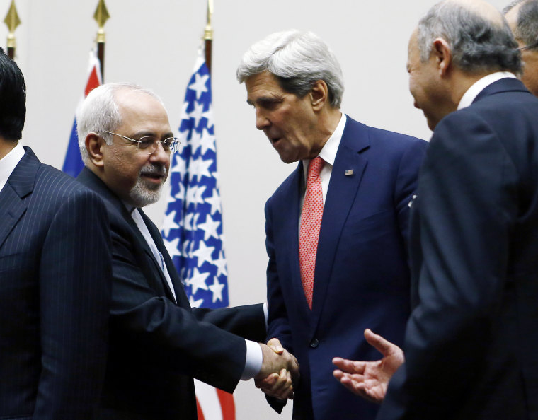 Secretary of State John Kerry (R) shakes hands with Iranian Foreign Minister Mohammad Javad Zarif after a ceremony at the United Nations in Geneva on Nov. 24, 2013.