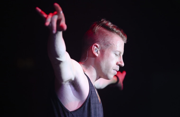 Hip-hop artist Macklemore preforms at the Best Buy Theater in Times Square on Nov. 21, 2013, in New York.