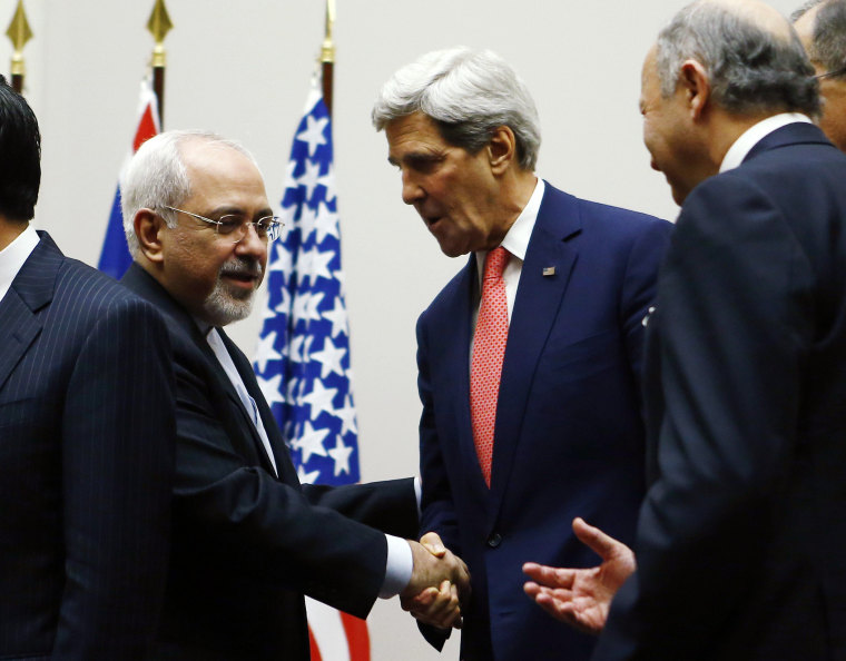 U.S. Secretary of State John Kerry shakes hands with Iranian Foreign Minister Mohammad Javad Zarif after a ceremony at the United Nations in Geneva, November 24, 2013.