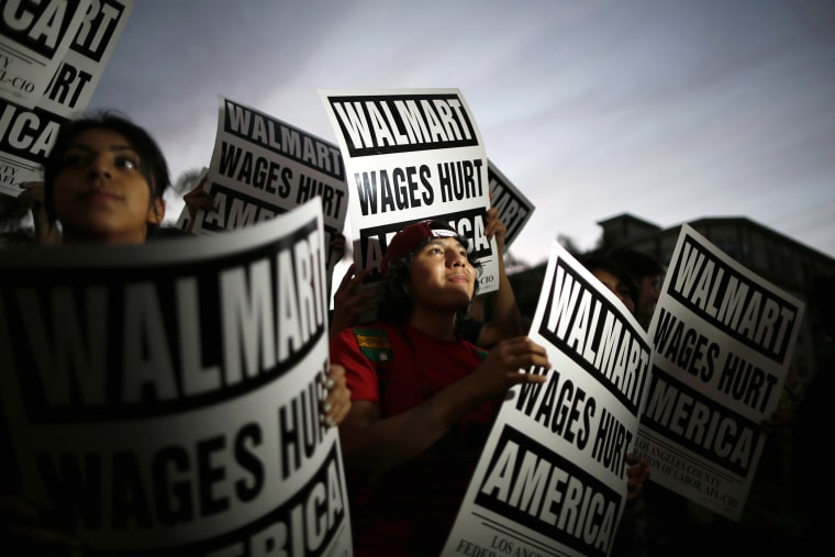 Pedro Taverna, 18, takes part in a protest for better wages outside Wal-mart in Los Angeles on Nov. 7, 2013.