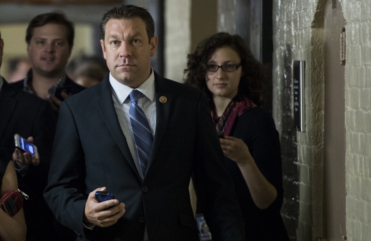 Rep. Trey Radel, R-Fla., speaks with reporters as he leaves the House Republican Conference meeting in the basement of the Capitol on Friday, Oct. 4, 2013.