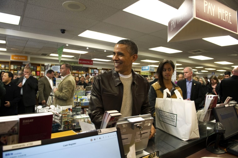 President Barack Obama shops with daughter Malia at Politics and Prose Bookstore and Coffeehouse in Washington, D.C. on Nov. 30, 2013.