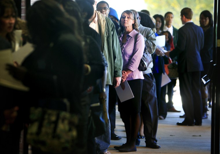 Jona Caldwell joins a long line of job seekers outside the Ferguson Community Center in Cordova, Tenn. waiting to get into a Tennessee Department of Labor job fair Thursday, Nov. 7, 2013.