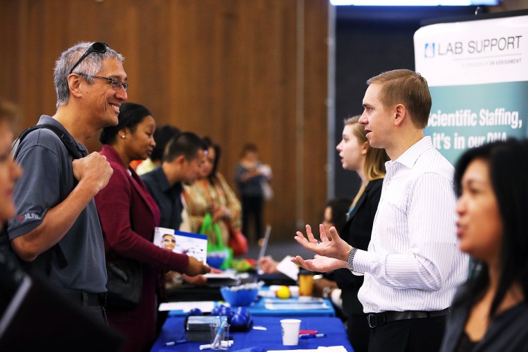 A job seeker meets with a recruiter during the Job Hunters Boot Camp in San Mateo, Calif. Oct. 16, 2013.