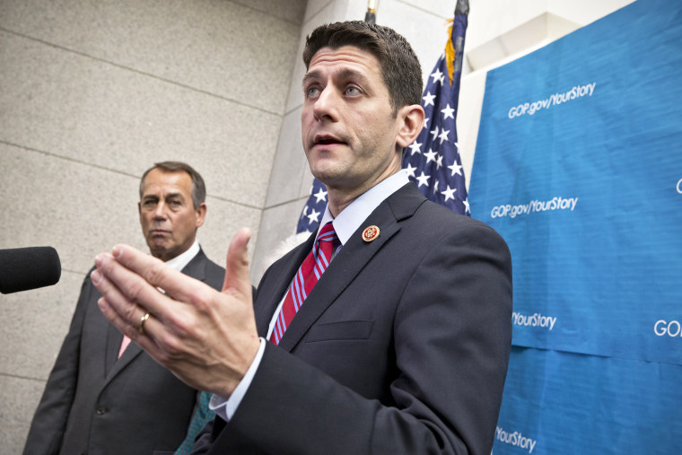 Paul Ryan takes reporters' questions as during a news conference on Capitol Hill, Dec. 11, 2013.