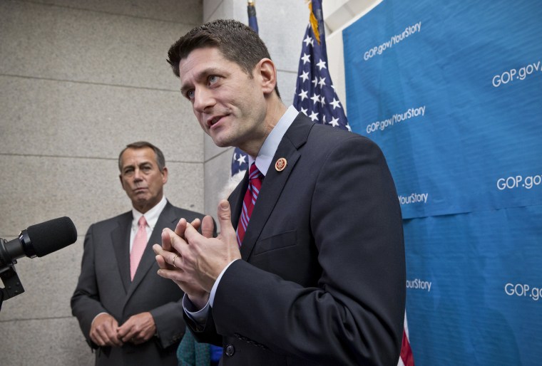 House Budget Committee Chairman Rep. Paul Ryan, R-Wis., right, accompanied by House Speaker John Boehner of Ohio, left, takes reporters' questions as during a news conference on Capitol Hill in Washington, Wednesday, December 11, 2013.