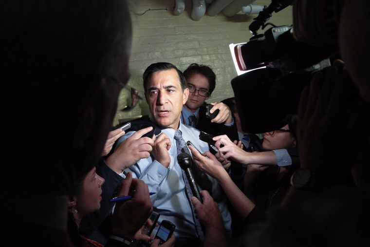 Representative Darrell Issa (R-CA) talks to reporters as he departs a House Republican caucus meeting at the U.S. Capitol in Washington, October 12, 2013.