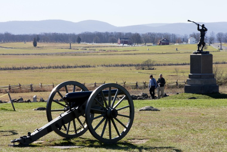 People visit the field of field Pickett's Charge, Monday, November 18, 2013, in Gettysburg, Pennsylvania.