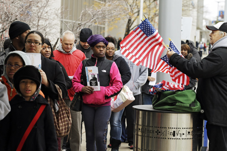 Voters wait in line outside the Cuyahoga County Board of Elections in Cleveland, Ohio on the final day of early voting Nov. 5, 2012.