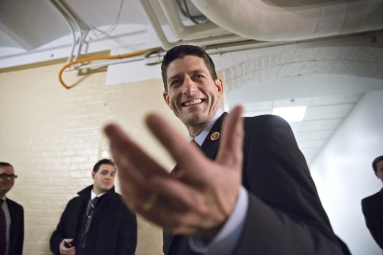 House Budget Committee Chairman Rep. Paul Ryan, R-Wis., gestures as he walks through a basement corridor on Capitol Hill in Washington, Wednesday, Dec. 11, 2013.