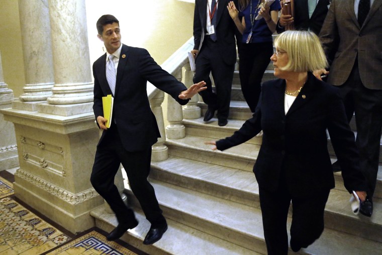 Senate Budget Committee chairman Senator Patty Murray (D-WA) (R) and House Budget Committee chairman Representative Paul Ryan (R-WI) (L) depart after a news conference to introduce The Bipartisan Budget Act of 2013 at the U.S. Capitol in Washington, Decem