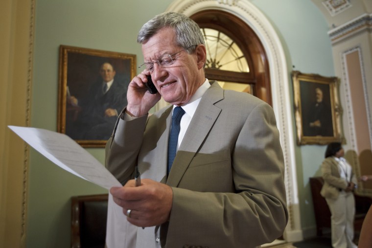 Sen. Max Baucus, D-Mont, steps off the Senate floor just after the bipartisan passage of the Farm Bill, at the Capitol in Washington, Thursday, June 21, 2012.