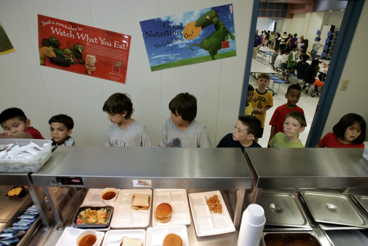 Children from McKamy Elementary School in Carrollton, Texas select food from the school cafeteria, Friday, Aug. 19, 2005.
