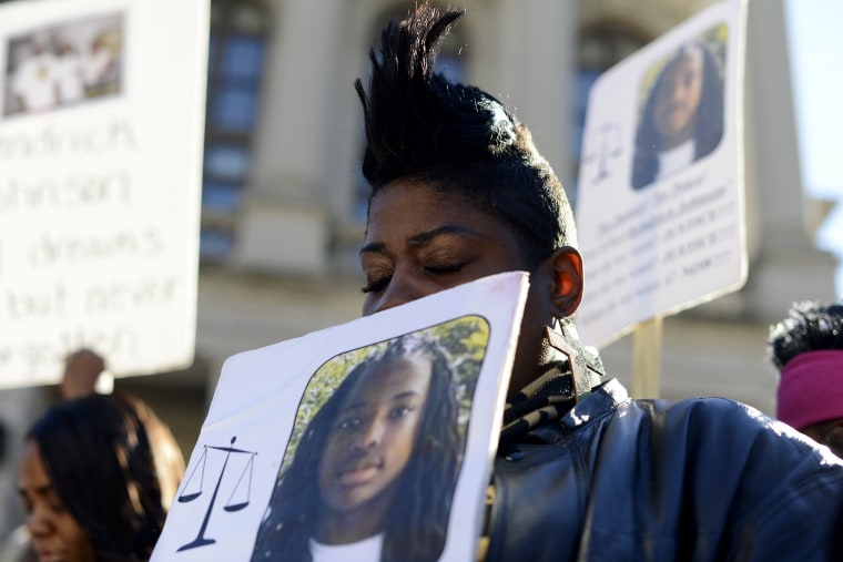 Tesha Tooley, an aunt Georgia teen Kendrick Johnson who was found dead in a gym mat at Lowndes County High School in Valdosta, Ga. , participates in a rally on his behalf at the Georgia State Capitol in Atlanta, Ga., Dec. 11, 2013.