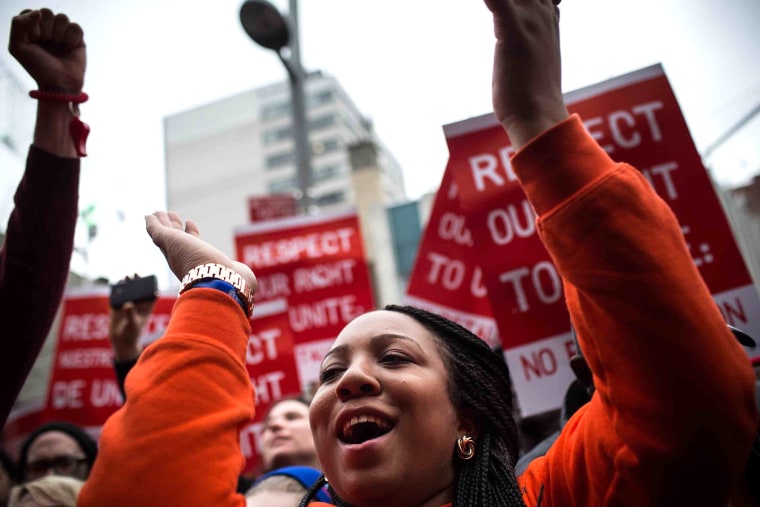 Protesters rally outside of a Wendy's in support of raising fast food wages from $7.25 per hour to $15.00 per hour on Dec. 5, 2013 in the Brooklyn borough of New York City.
