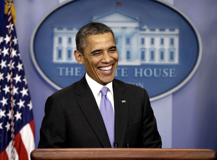 President Barack Obama smiles during an end-of-the year news conference in the Brady Press Briefing Room at the White House in Washington, Dec. 20, 2013.