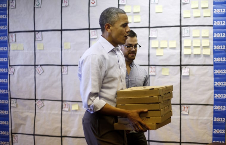President Barack Obama delivers pizzas for campaign volunteers during a visit to a local campaign office, Monday, Oct. 1, 2012 in Henderson, Nevada.