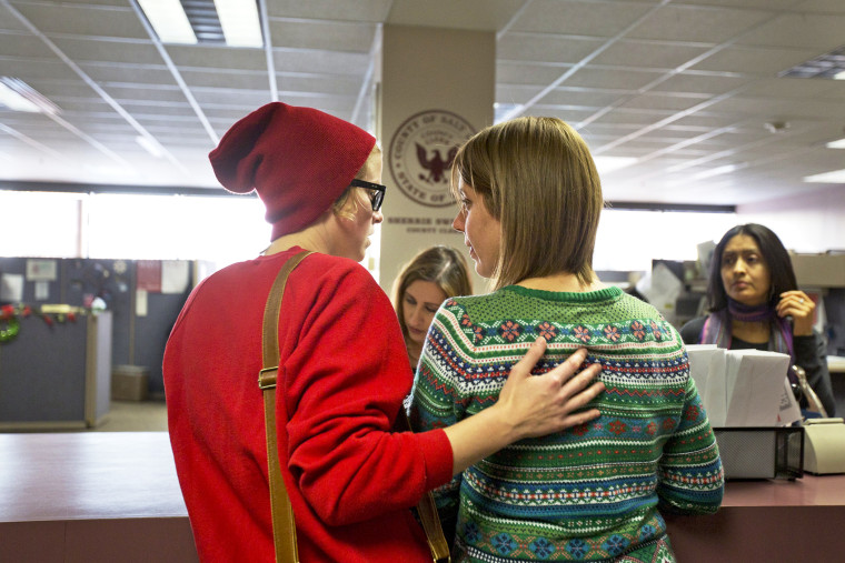 Samantha Christensen and Elise Larsen apply for a marriage license in the Salt Lake County Clerk's Office, Dec. 23, 2013.
